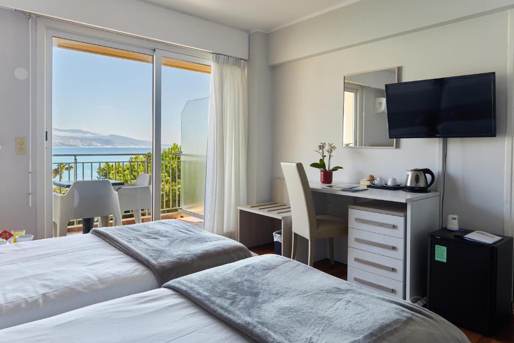 Postel nebo postele na pokoji v ubytování Hôtel Alexandra