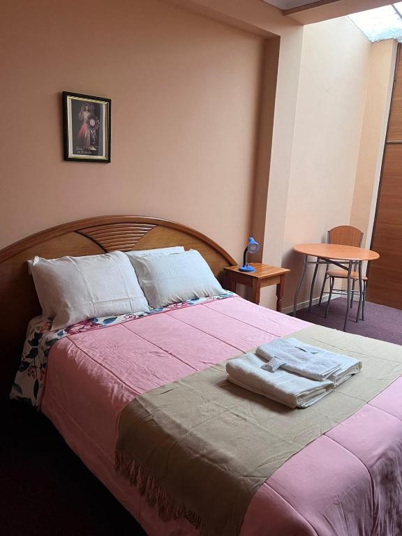 Postel nebo postele na pokoji v ubytování Posada Don Giorgio