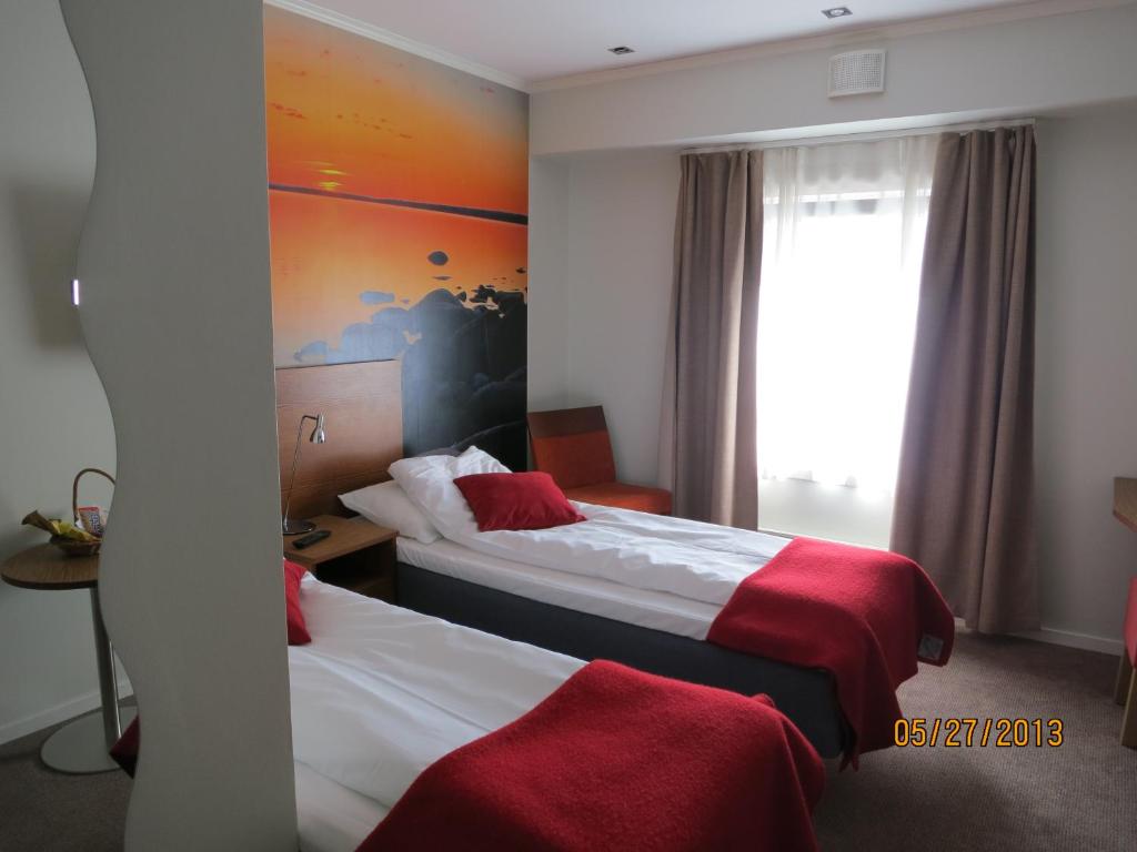 Postel nebo postele na pokoji v ubytování Kysthotellet Rørvik