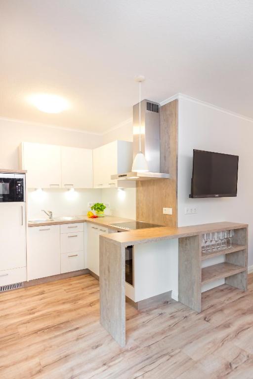 Kuchyň nebo kuchyňský kout v ubytování Hotel Noltmann-Peters