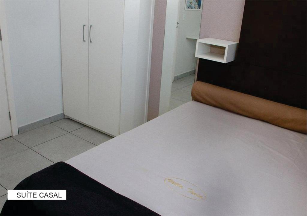 Postel nebo postele na pokoji v ubytování Villa Tata Suítes Ltda