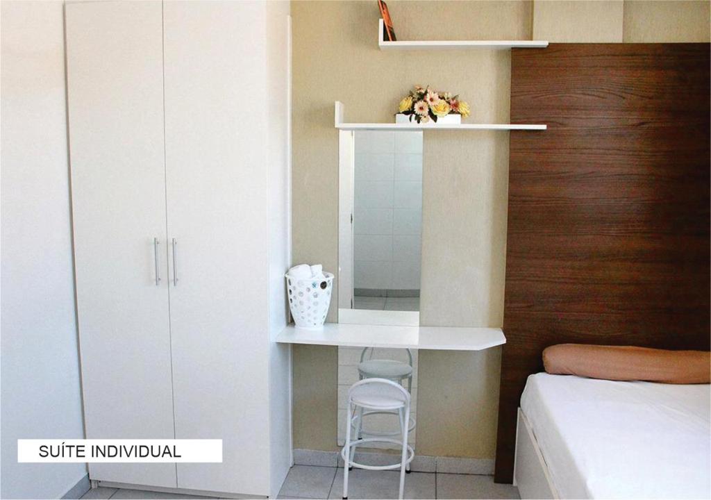 Postel nebo postele na pokoji v ubytování Villa Tata Suítes Ltda