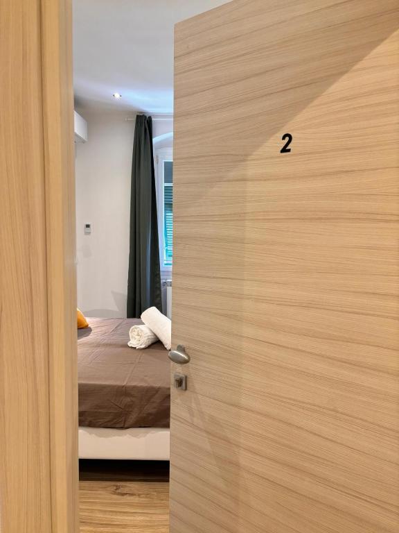 Postel nebo postele na pokoji v ubytování Al molo 21