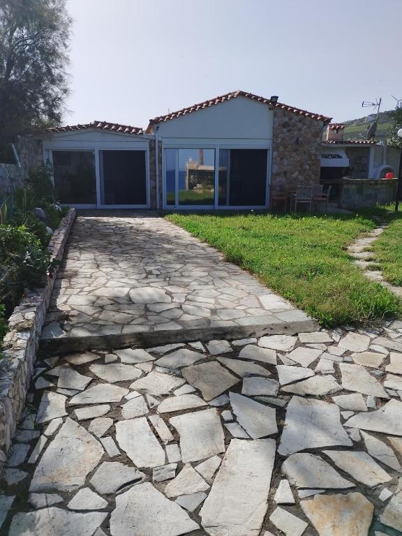 a stone walkway in front of a house at Το πέτρινο 2 in Agia Marina Mikrolimanou