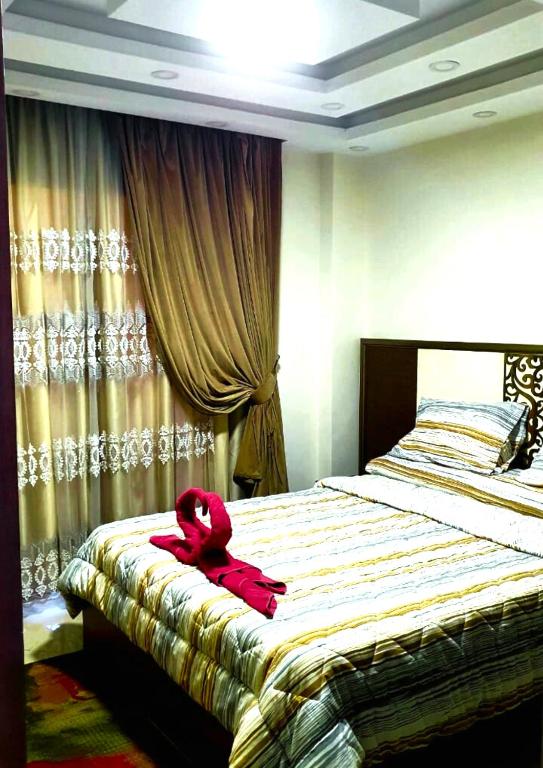 Postel nebo postele na pokoji v ubytování Luxury Sharm Hills Resort
