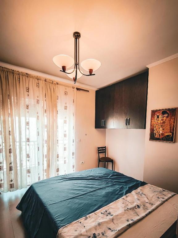 Postel nebo postele na pokoji v ubytování Skyline Apartments Tirana