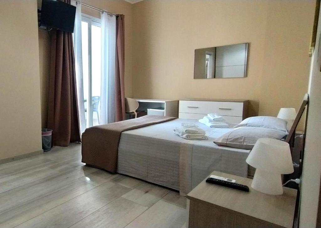 Postel nebo postele na pokoji v ubytování Giliberto Rooms