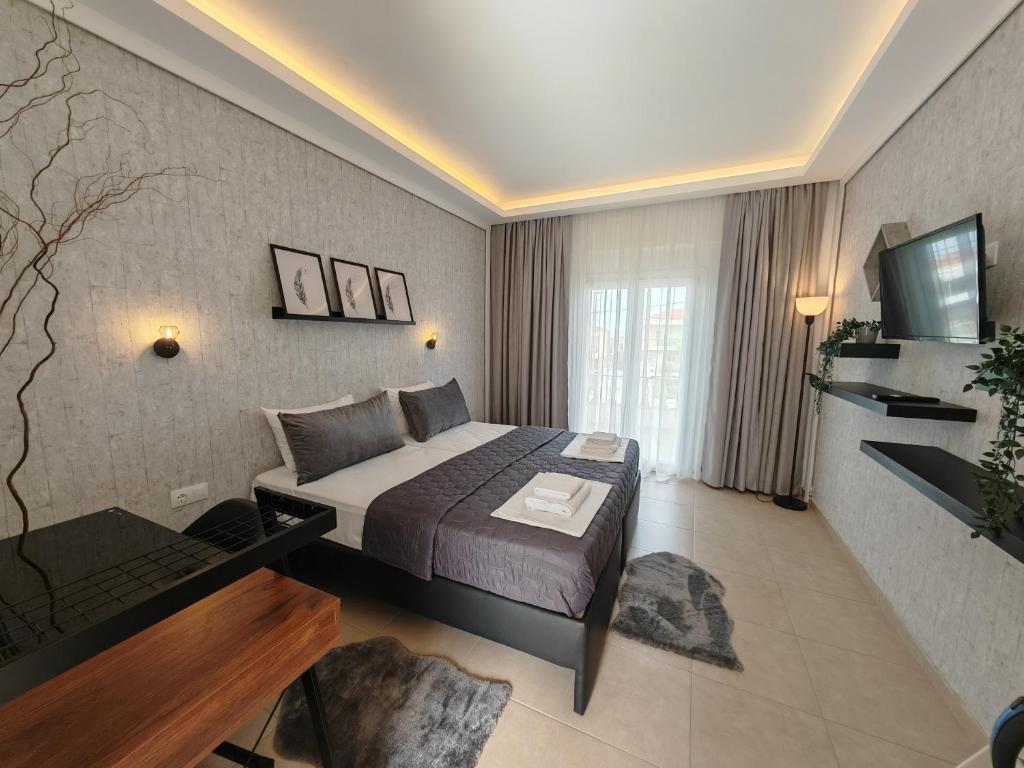 A bed or beds in a room at Hotel Valerios