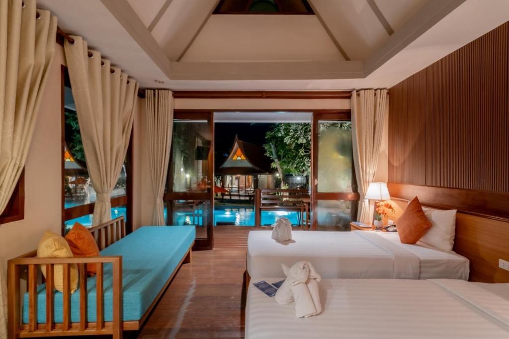 Postel nebo postele na pokoji v ubytování Baan Duangkaew Resort