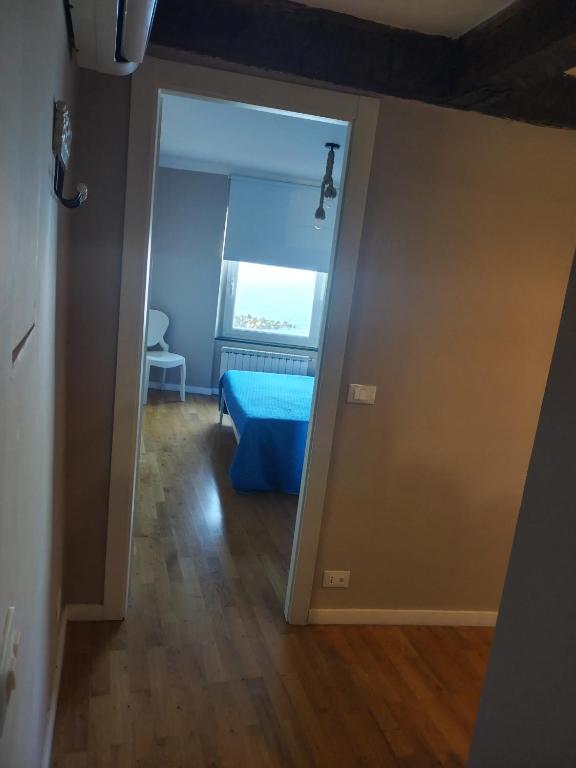 Un ou plusieurs lits dans un hébergement de l'établissement Casa Tabata fronte mare
