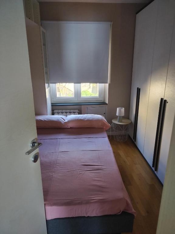 Un ou plusieurs lits dans un hébergement de l'établissement Casa Tabata fronte mare
