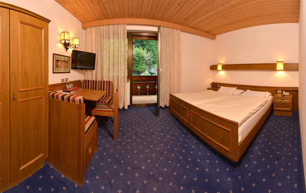 Postel nebo postele na pokoji v ubytování Hotel Pontives