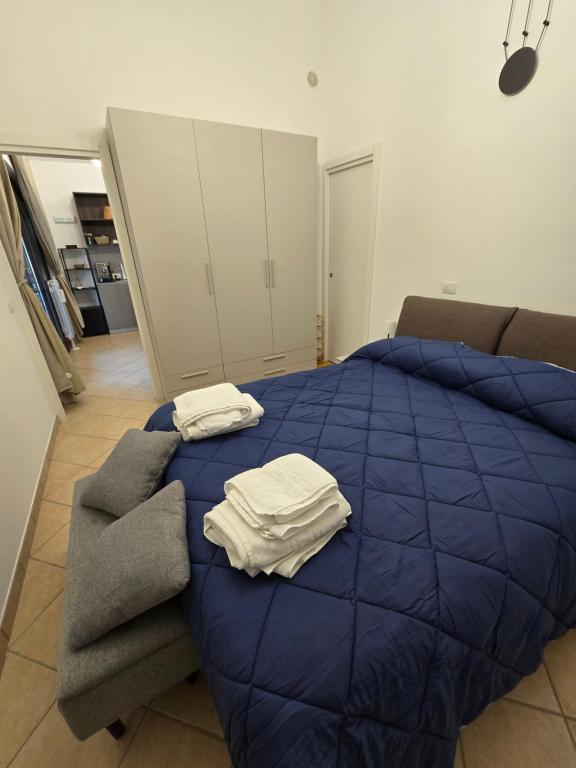Postel nebo postele na pokoji v ubytování Dimora Kalipè