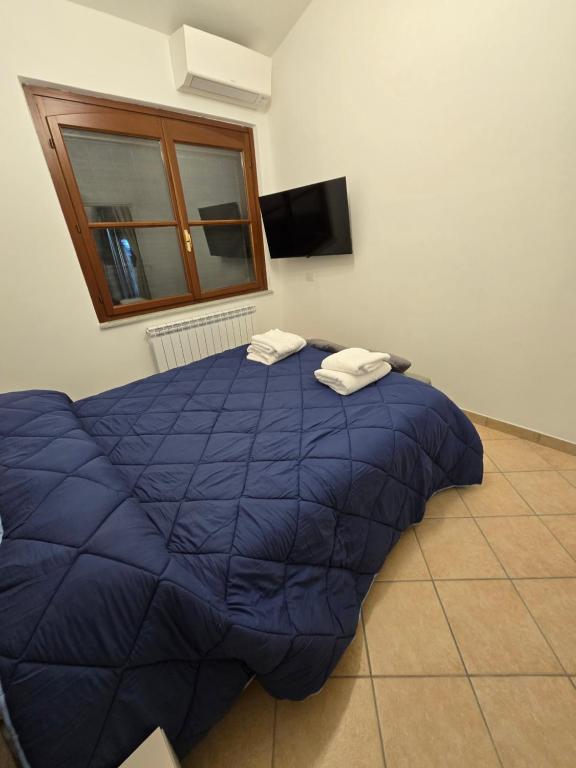 Postel nebo postele na pokoji v ubytování Dimora Kalipè