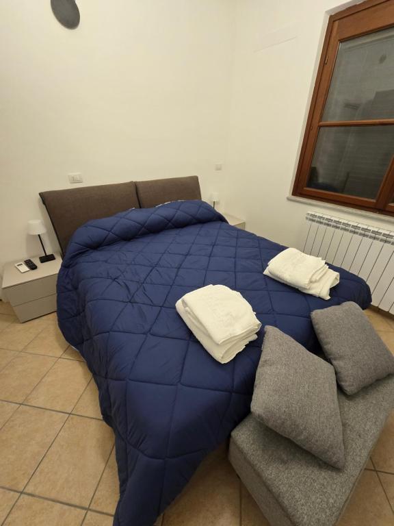 Postel nebo postele na pokoji v ubytování Dimora Kalipè
