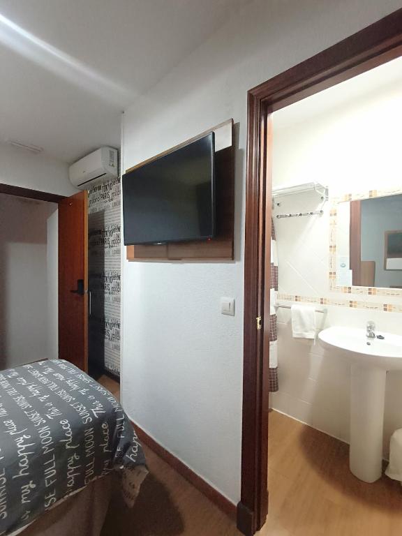 TV a/nebo společenská místnost v ubytování Hostal San Francisco