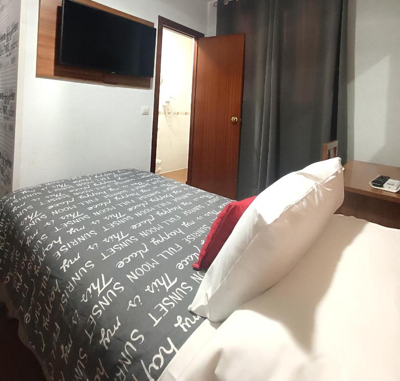 Postel nebo postele na pokoji v ubytování Hostal San Francisco