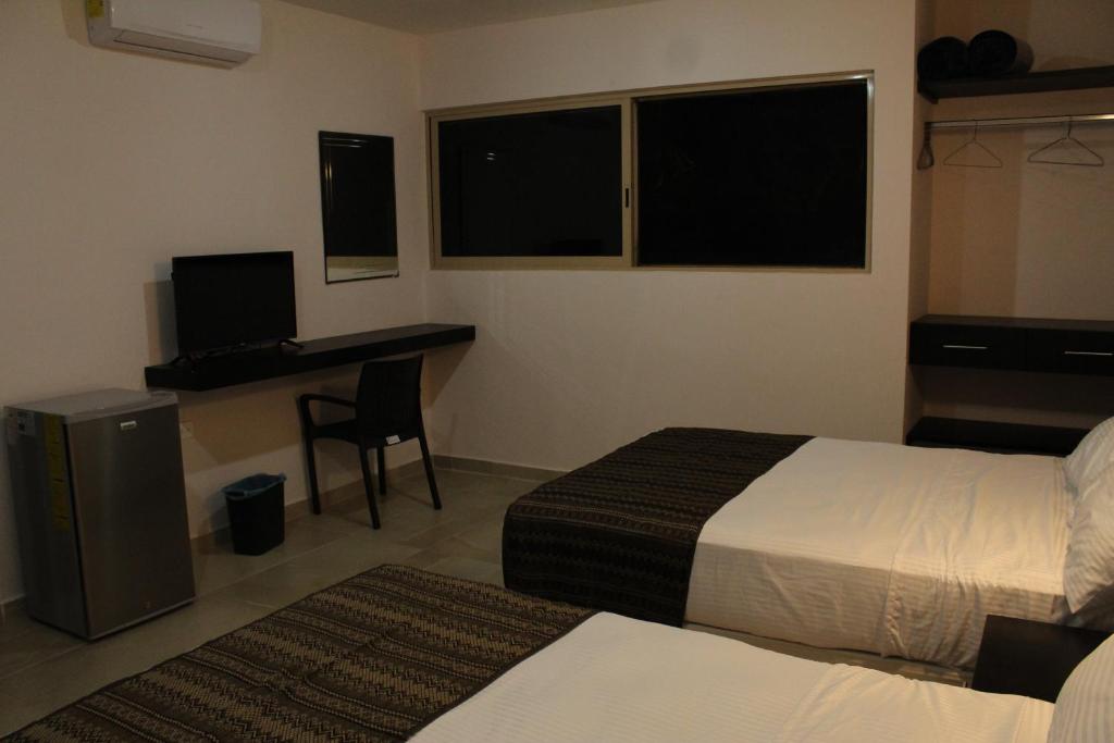 Postel nebo postele na pokoji v ubytování Hotel Virreyes