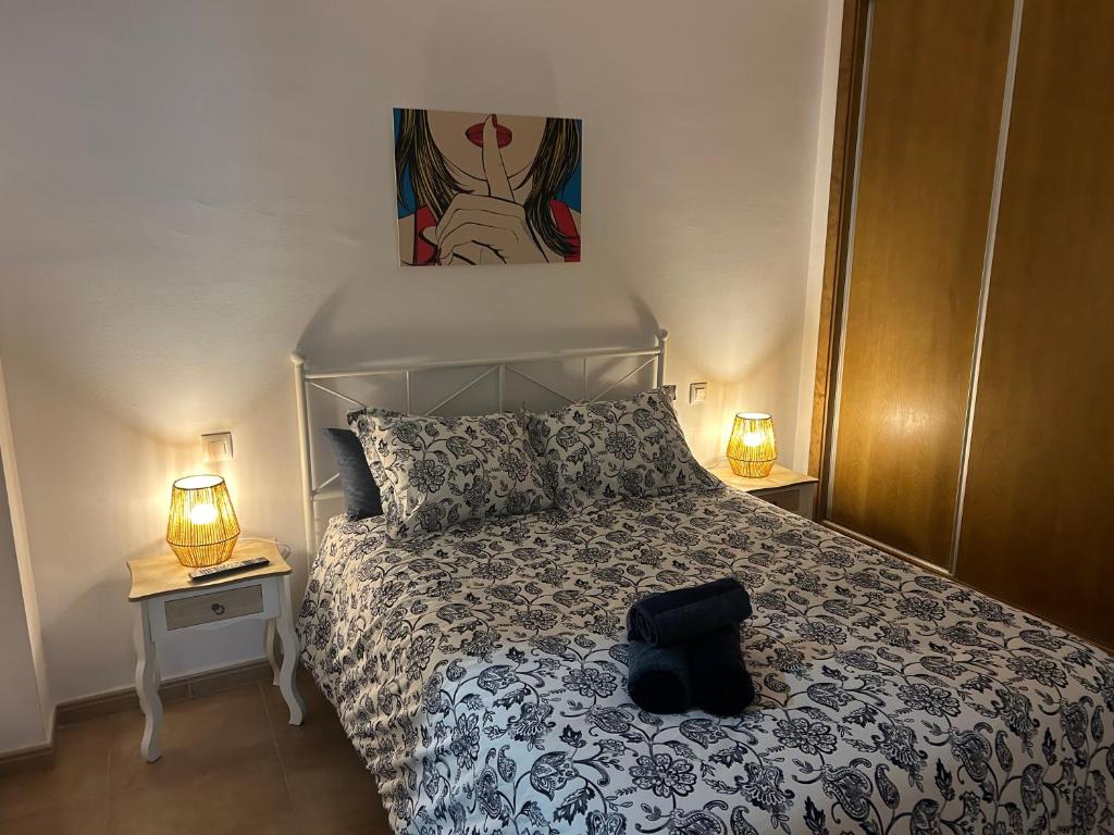 A bed or beds in a room at Palma 2 sueños