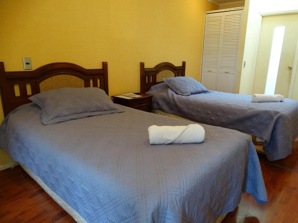 Postel nebo postele na pokoji v ubytování Hostal Don Guillermo