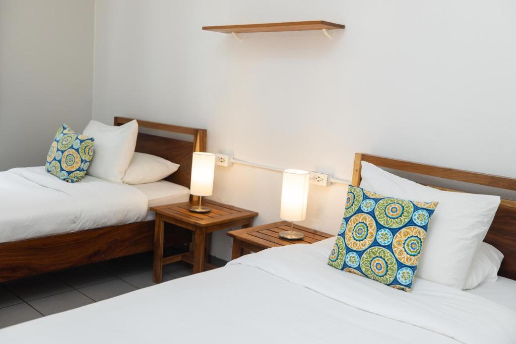 Postel nebo postele na pokoji v ubytování Alma Vida Hotel