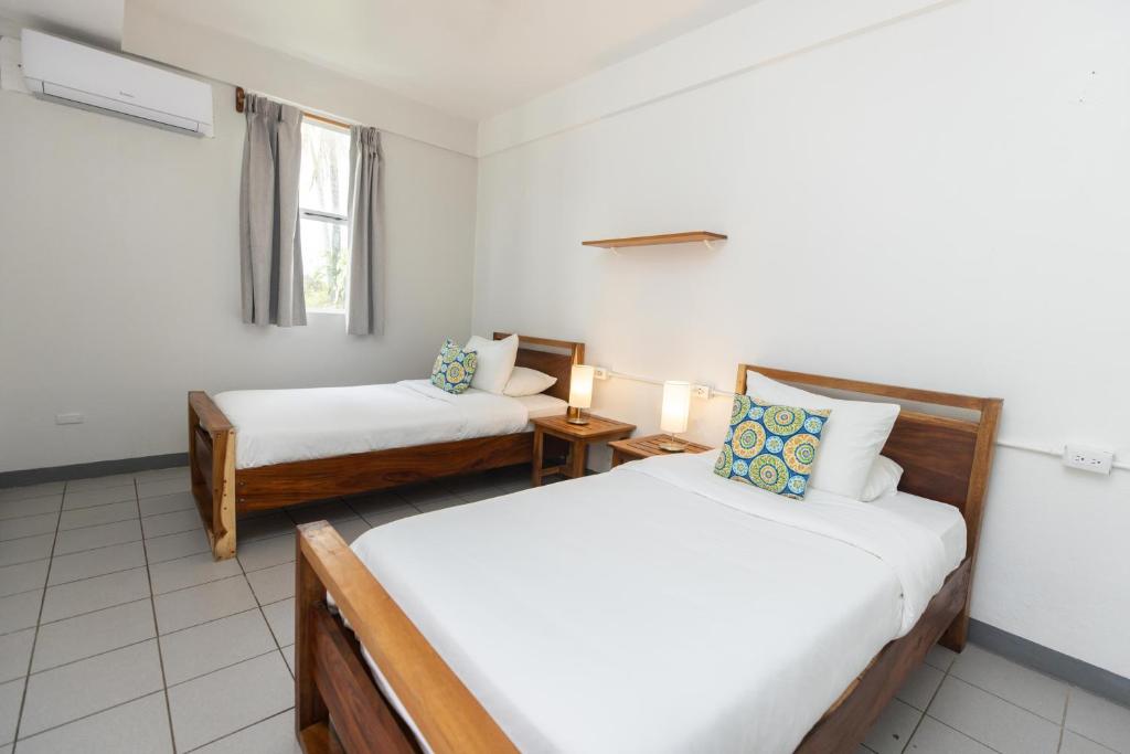 Postel nebo postele na pokoji v ubytování Alma Vida Hotel