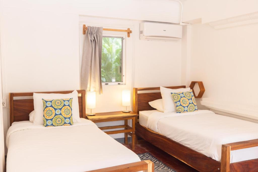 Postel nebo postele na pokoji v ubytování Alma Vida Hotel
