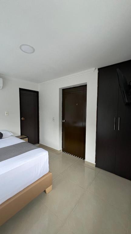 Postel nebo postele na pokoji v ubytování Hotel Medellín 66