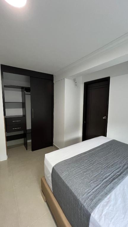 Postel nebo postele na pokoji v ubytování Hotel Medellín 66