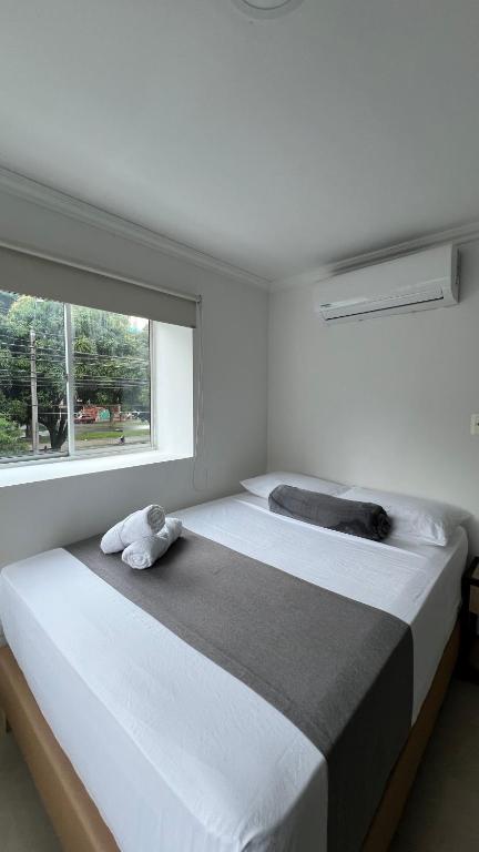 Postel nebo postele na pokoji v ubytování Hotel Medellín 66