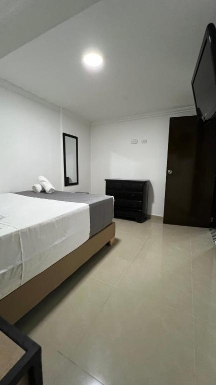 Postel nebo postele na pokoji v ubytování Hotel Medellín 66