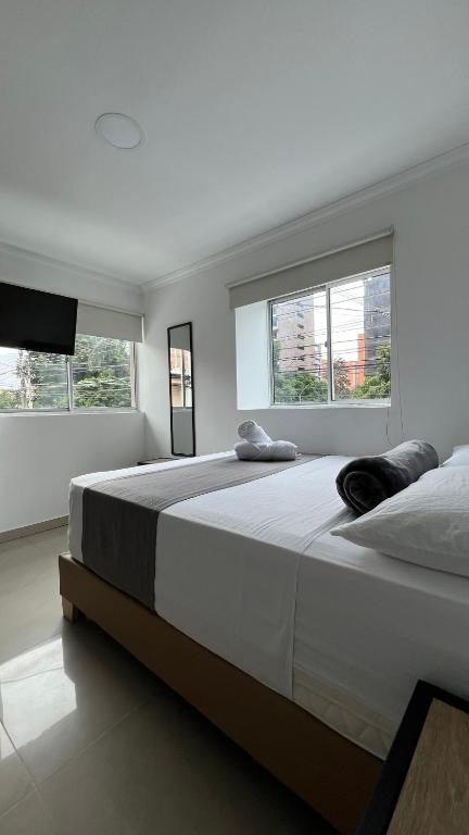 Postel nebo postele na pokoji v ubytování Hotel Medellín 66