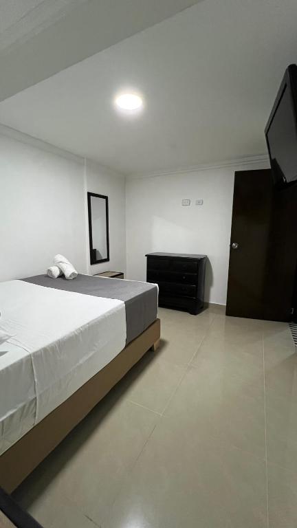 Postel nebo postele na pokoji v ubytování Hotel Medellín 66
