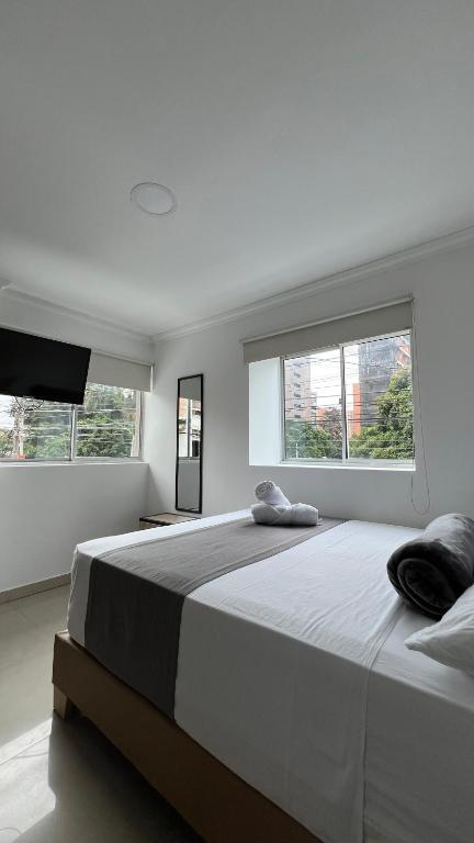 Postel nebo postele na pokoji v ubytování Hotel Medellín 66