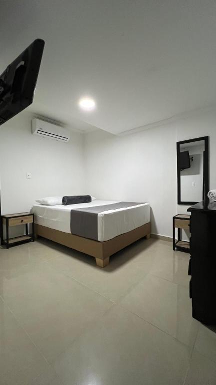 Postel nebo postele na pokoji v ubytování Hotel Medellín 66