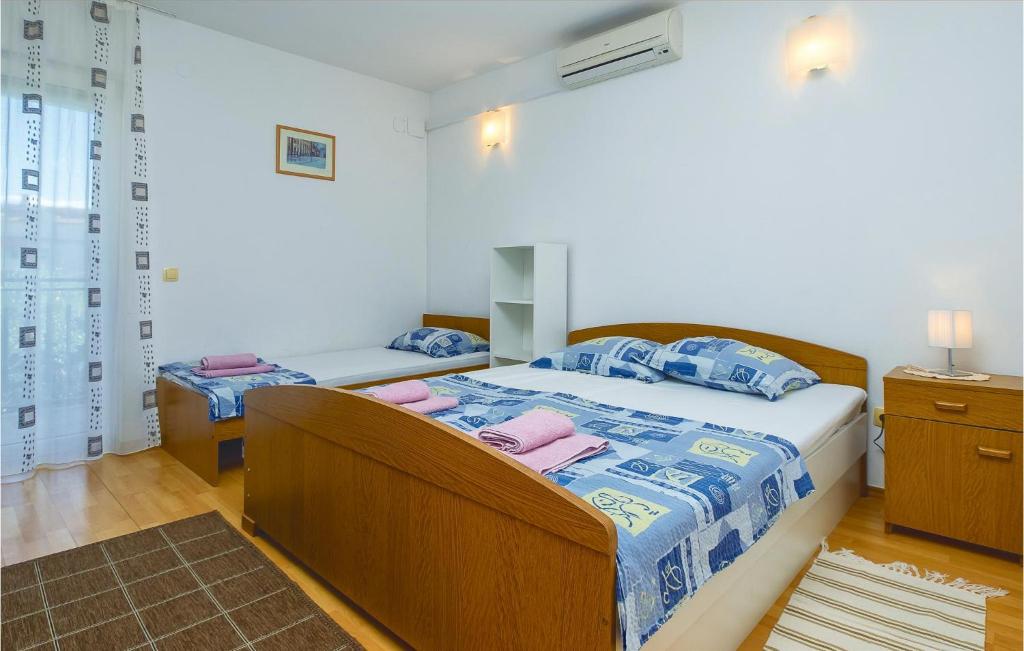 Posteľ alebo postele v izbe v ubytovaní Apartment Duce Luka Iv