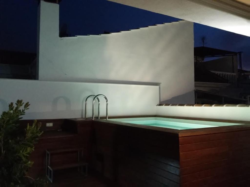 a kitchen with a sink and a bath tub at Casa Caballero de la Rosa in Priego de Córdoba