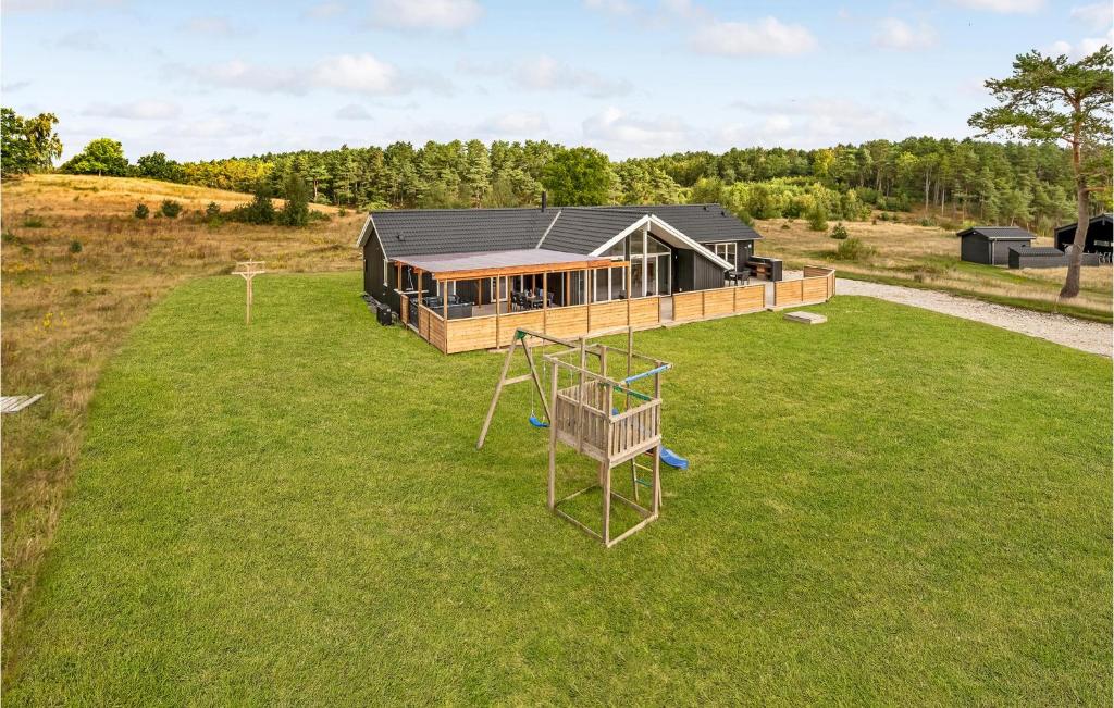 an overhead view of a house with a playground at Lovely Home In Ebeltoft With Sauna in Ebeltoft