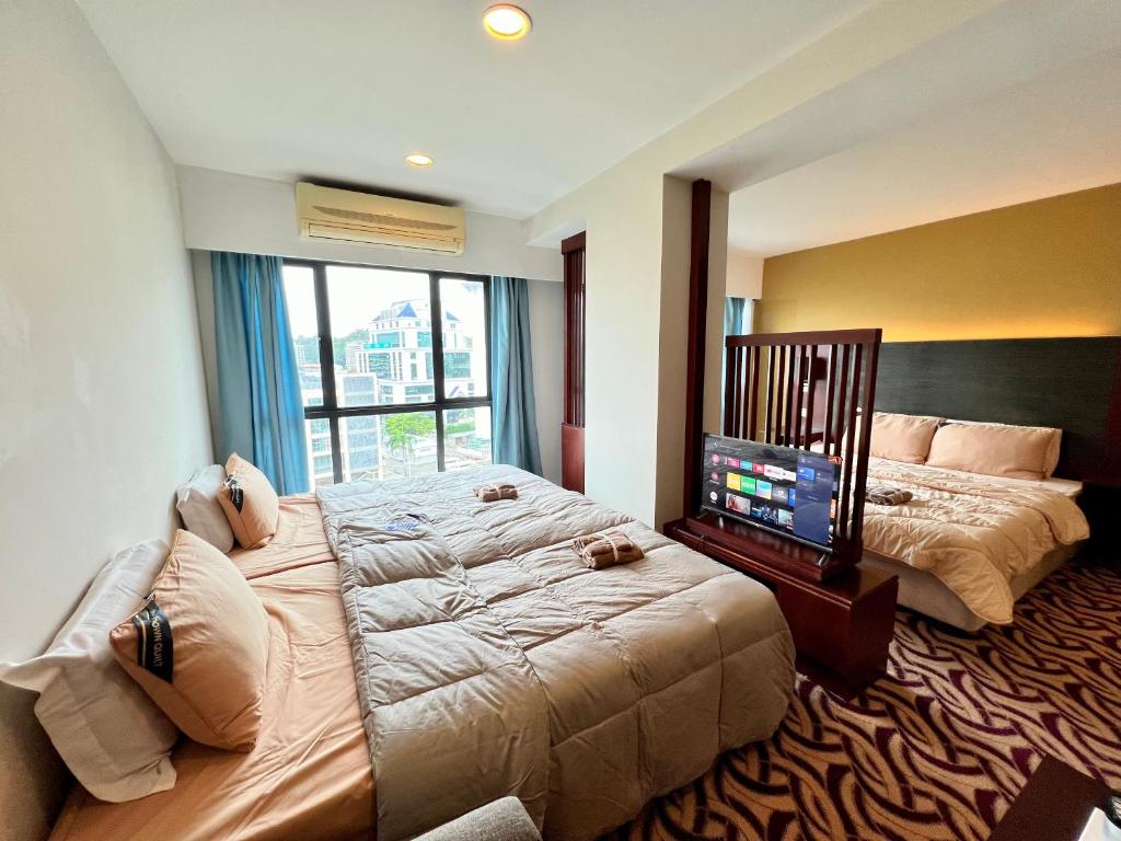 Ένα ή περισσότερα κρεβάτια σε δωμάτιο στο Faina Homestay SCSP Ming Resident