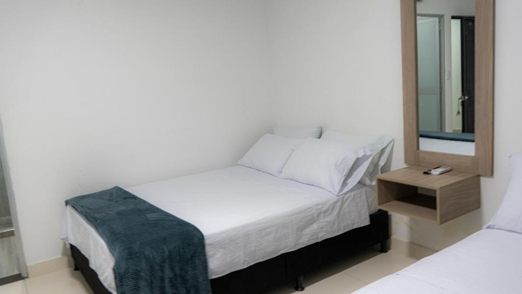 Ένα ή περισσότερα κρεβάτια σε δωμάτιο στο Hotel Boutique Damasco