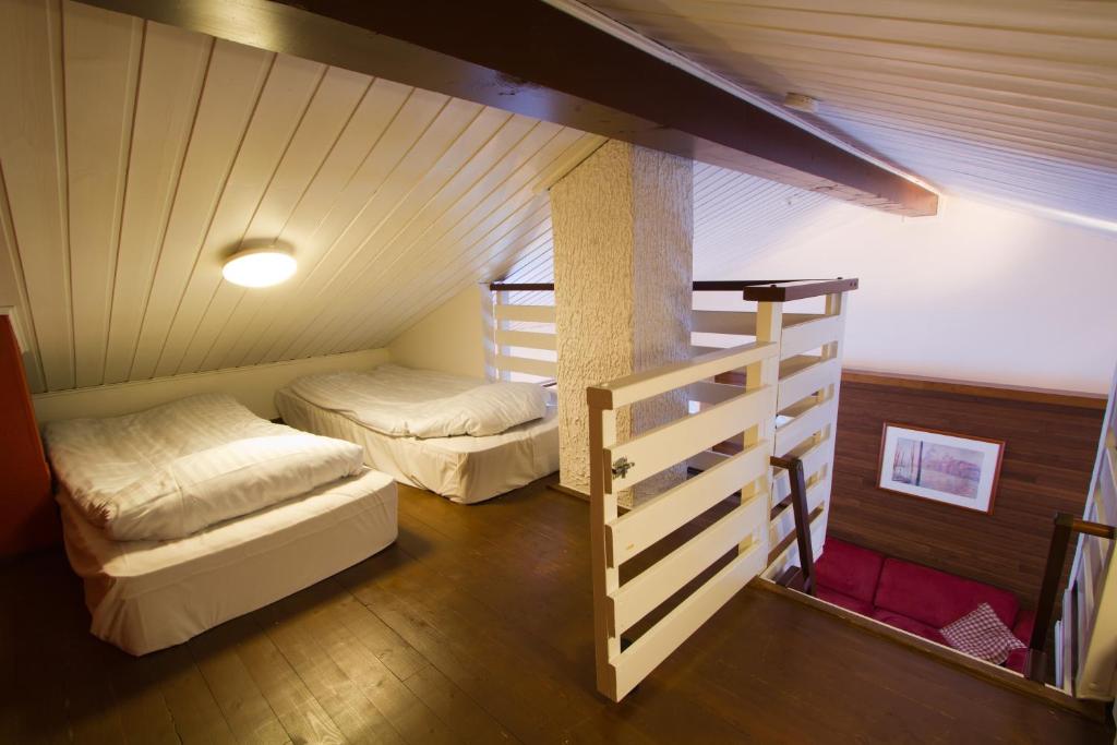Postel nebo postele na pokoji v ubytování Polar Star Apartments