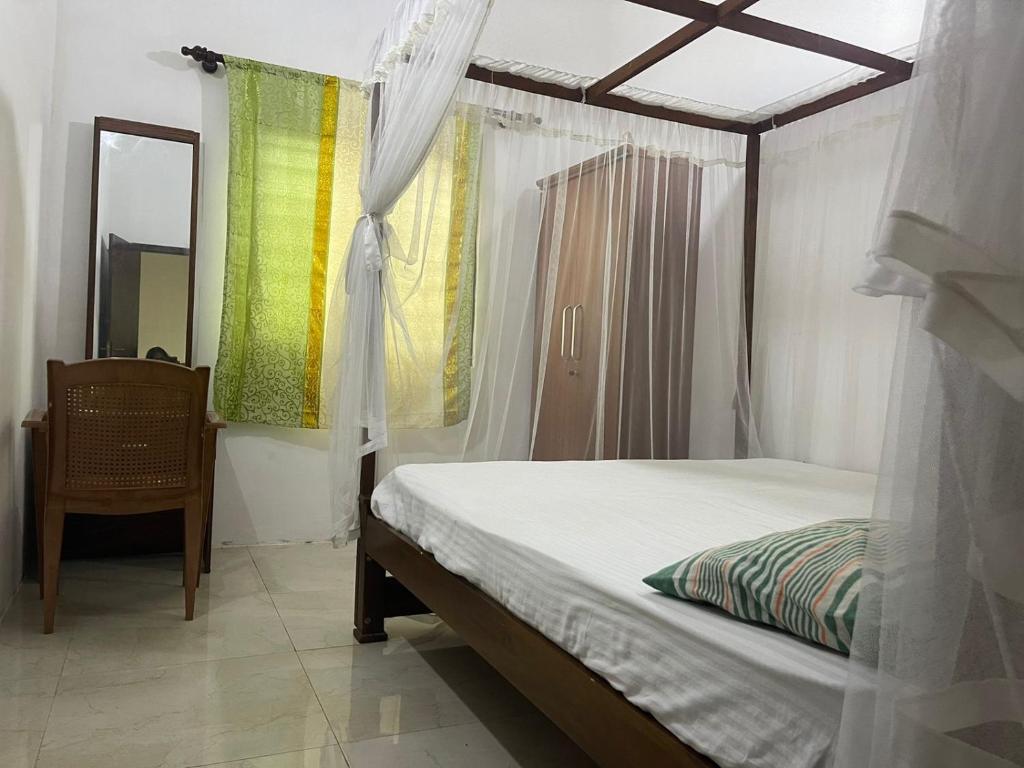 En eller flere senge i et værelse på Hetti Villa