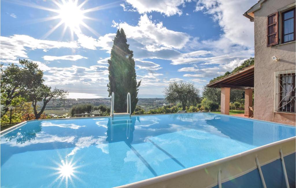 a swimming pool in a villa with a cactus at 4 Bedroom Nice Home In Pietrasanta in Pietrasanta