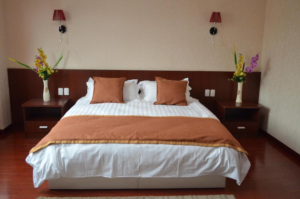 Postel nebo postele na pokoji v ubytování Hotel 198