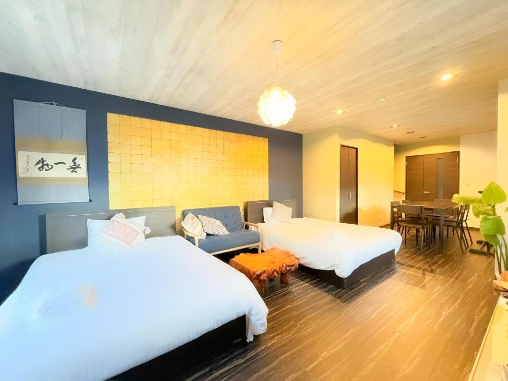 Ένα ή περισσότερα κρεβάτια σε δωμάτιο στο Niseko VILLA KIRAKU TSURU 車利用にオススメ 各スキー場迄車で約15分