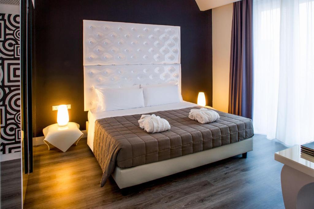 Postel nebo postele na pokoji v ubytování Hotel Da Vinci