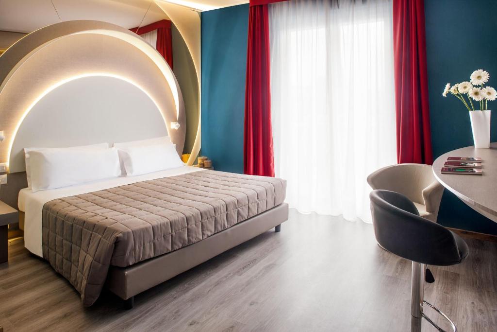 Postel nebo postele na pokoji v ubytování Hotel Da Vinci