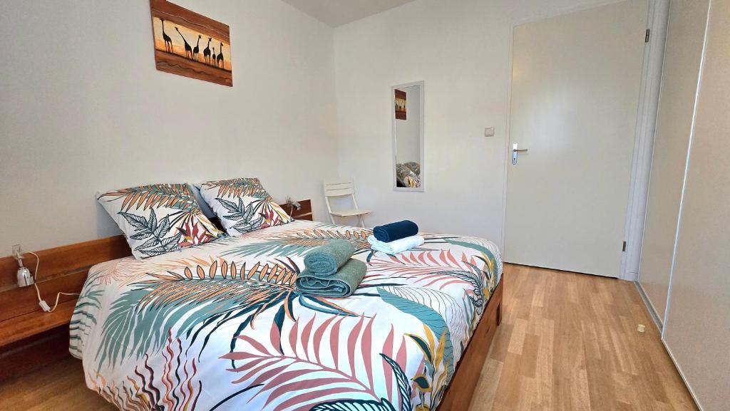 Ένα ή περισσότερα κρεβάτια σε δωμάτιο στο Appartement 1 Chambre "Le Carré des Antilles"