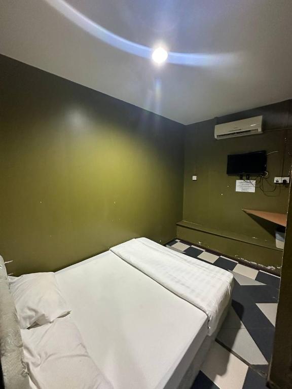 Postel nebo postele na pokoji v ubytování Motel Terminal Inn Inanam