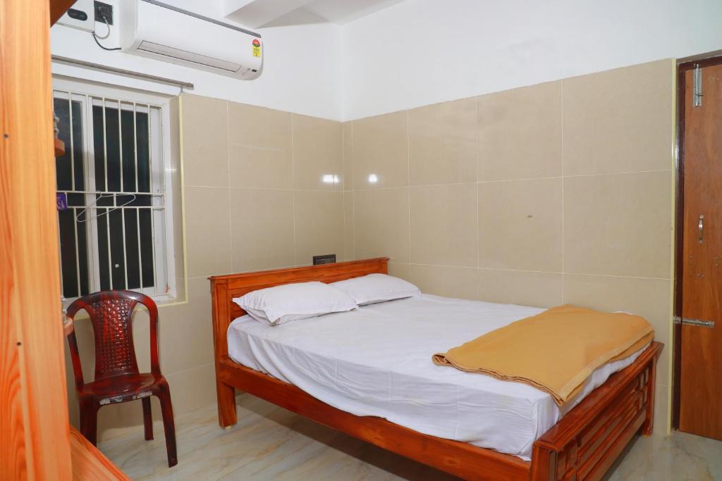 Postel nebo postele na pokoji v ubytování Lily Homestay